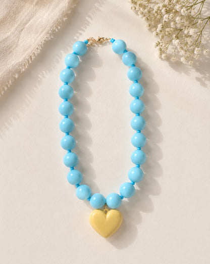 COLLAR AZUL CON CORAZON MARFIL